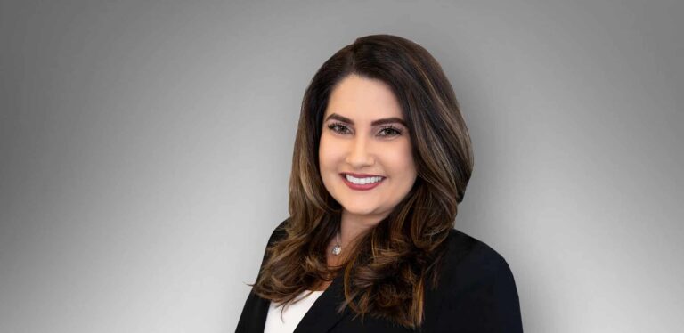 Mary Korkorian, woman attorney in a navy suit