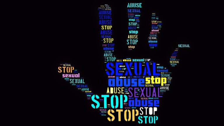 A hand silhouette filled with colorful words like “STOP,” “SEXUAL,” and “ABUSE” on a black background, symbolizing a call to end sexual abuse and support survivors.