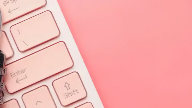 A combination padlock resting on a pink computer keyboard, symbolizing cybersecurity or data protection, with a bright pink background.