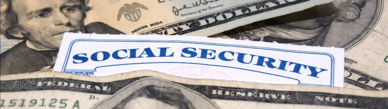 A Social Security card is partially visible among overlapping U.S. dollar bills, including $20 and $100 notes, suggesting a theme of finances or social benefits.