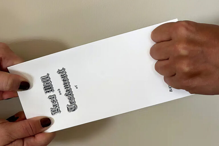 Two hands on the left pull on a legal document while a fist on the right tightly grabs the other end, suggesting a struggle or dispute over the paper. The background is a plain, light-colored wall.